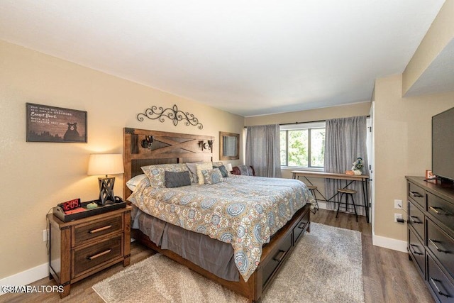 bedroom featuring hardwood / wood-style floors