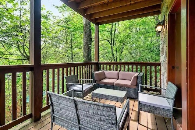 wooden deck with an outdoor living space