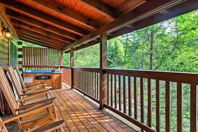 deck with a hot tub