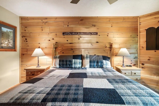 bedroom featuring wood walls