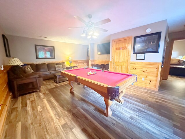 playroom with wooden walls, ceiling fan, hardwood / wood-style flooring, and pool table