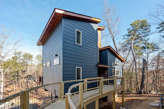 rear view of property with a wooden deck