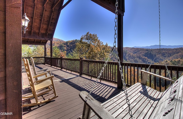 wooden terrace with a mountain view