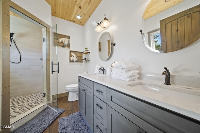 full bath featuring a sink, a shower stall, vaulted ceiling, wood ceiling, and toilet