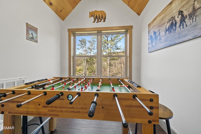 game room with vaulted ceiling and wood ceiling