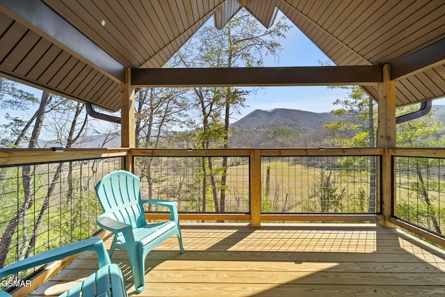 wooden terrace with a mountain view