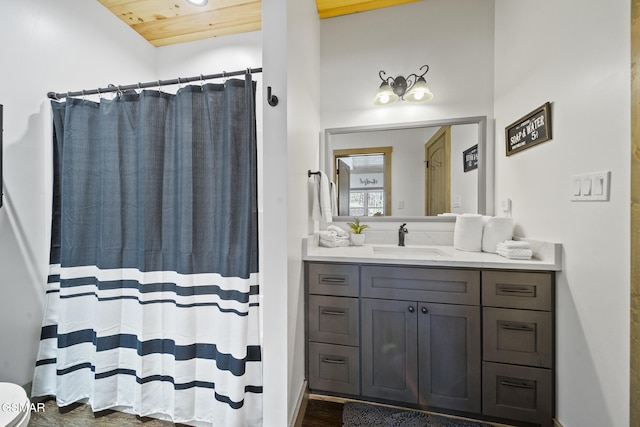 bathroom with vanity, a shower with curtain, and wood ceiling