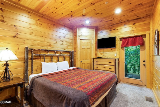 bedroom featuring wood walls, carpet floors, and wood ceiling