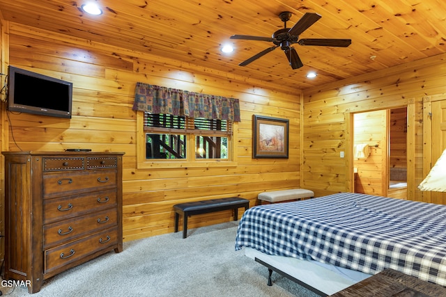 carpeted bedroom featuring wooden ceiling, ceiling fan, and wooden walls