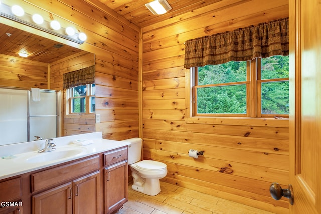 bathroom with wood walls, wood ceiling, and walk in shower