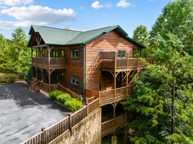 rear view of property with a balcony