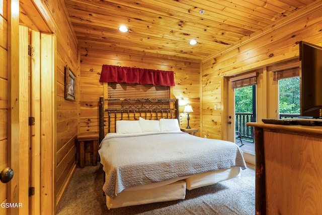 carpeted bedroom with access to exterior, wooden walls, and wooden ceiling