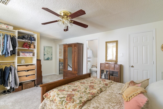 bedroom featuring visible vents, a closet, a textured ceiling, and carpet floors