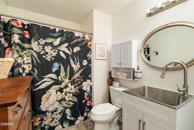 full bathroom with toilet, vanity, a shower with curtain, and a textured ceiling