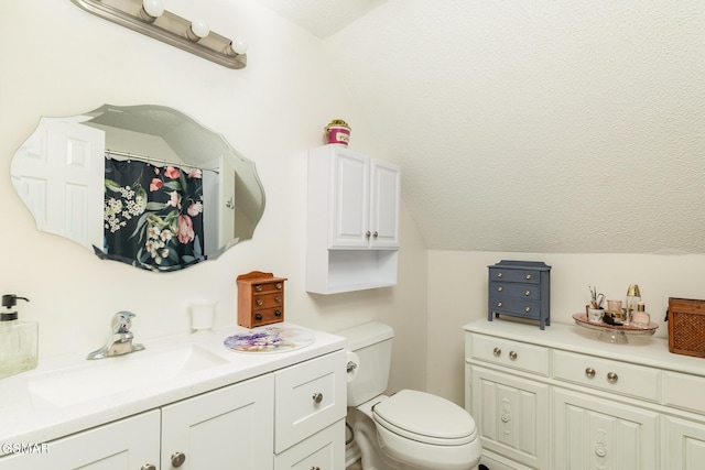 bathroom featuring a textured ceiling, vanity, a shower with curtain, toilet, and lofted ceiling