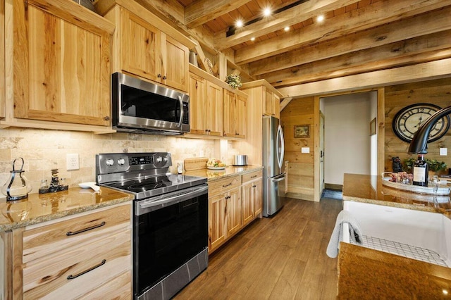 kitchen with light brown cabinets, wooden ceiling, beamed ceiling, and appliances with stainless steel finishes