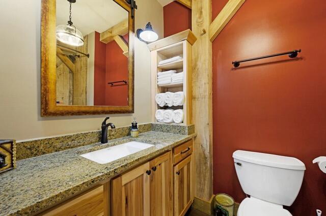 bathroom with toilet and vanity