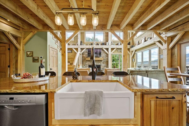 interior space with sink, wooden ceiling, a bathing tub, and beam ceiling