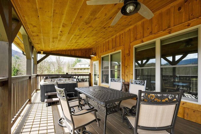 wooden terrace featuring ceiling fan