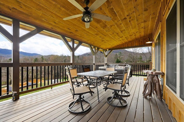 deck with ceiling fan and a mountain view