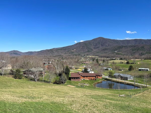 property view of mountains with a water view and a rural view