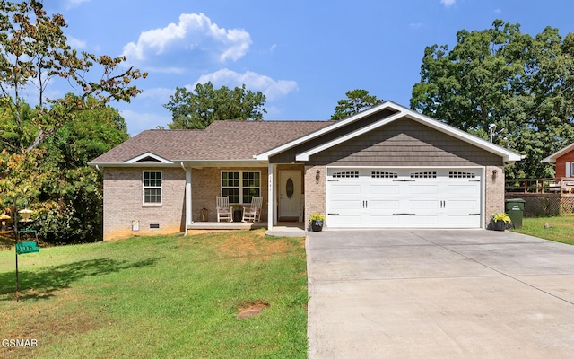 ranch-style house with an attached garage, brick siding, concrete driveway, crawl space, and a front lawn