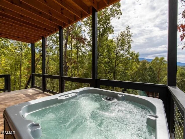 2434 Breezy Rd, Sevierville, TN 37876 - deck featuring a hot tub and a view of trees