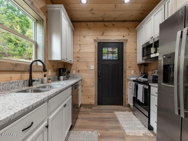 2434 Breezy Rd, Sevierville, TN 37876 - kitchen featuring appliances with stainless steel finishes, a sink, wood ceiling, white cabinetry, and recessed lighting