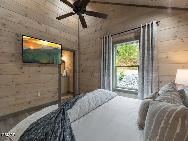 2434 Breezy Rd, Sevierville, TN 37876 - bedroom with wood walls, wood finished floors, and a ceiling fan