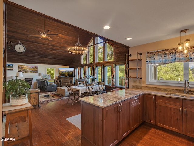 730 Deerfoot Dr, Gatlinburg, TN 37738 - kitchen with a sink, light stone counters, plenty of natural light, a chandelier, and recessed lighting