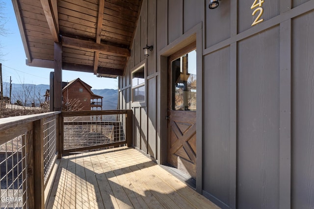 wooden terrace featuring a mountain view