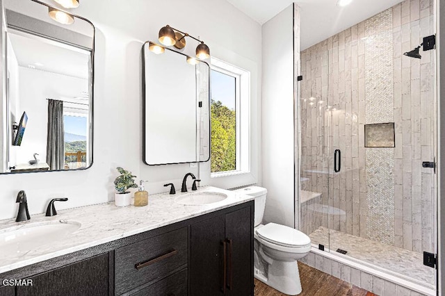 937 Autumn Ridge Way, Sevierville, TN 37876 - full bath featuring a shower stall, double vanity, toilet, and wood finished floors
