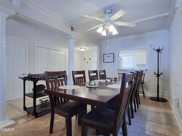 tiled dining area featuring decorative columns, ornamental molding, and ceiling fan