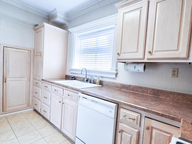 kitchen with sink, crown molding, light tile patterned floors, and dishwasher