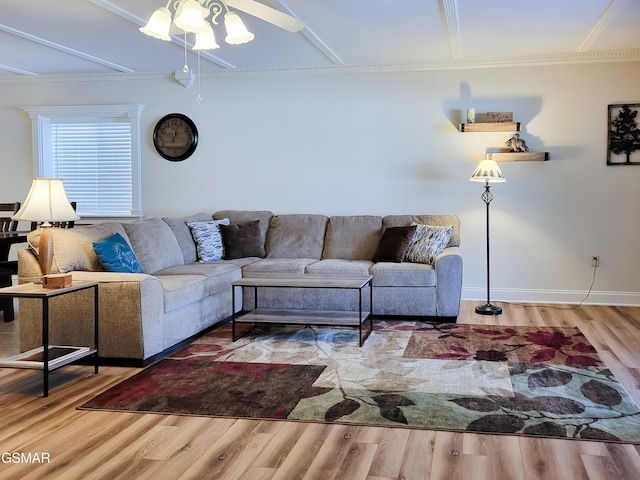 living room with hardwood / wood-style floors and crown molding