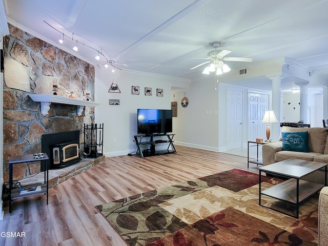 living room with rail lighting, ornate columns, crown molding, hardwood / wood-style flooring, and ceiling fan