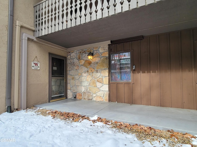 view of snow covered property entrance