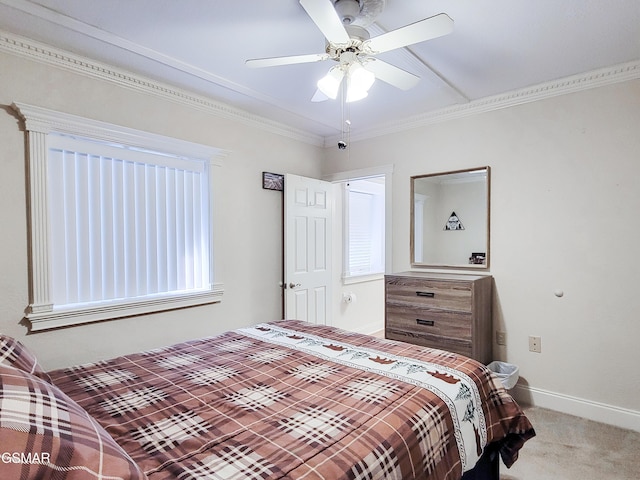 bedroom featuring crown molding, light carpet, and ceiling fan