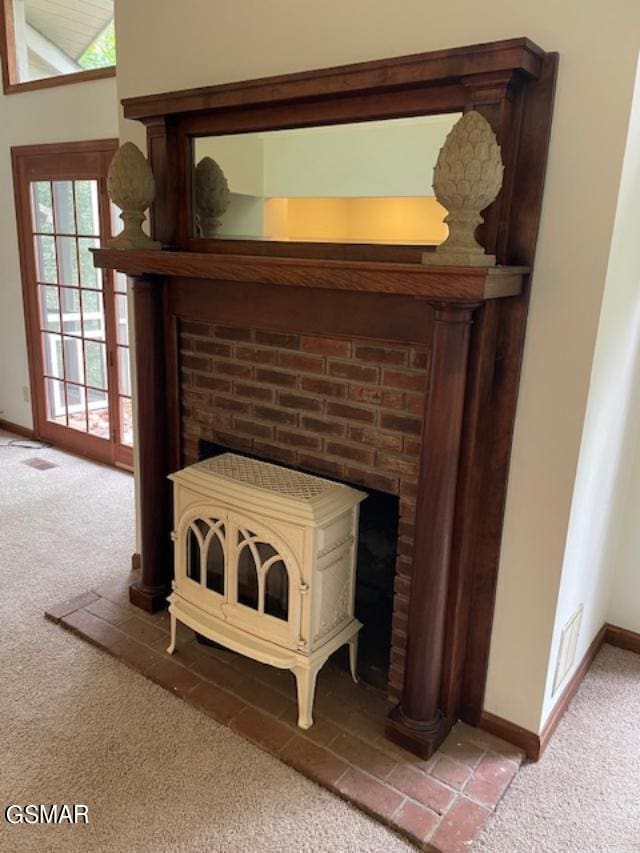 details featuring carpet flooring and a wood stove