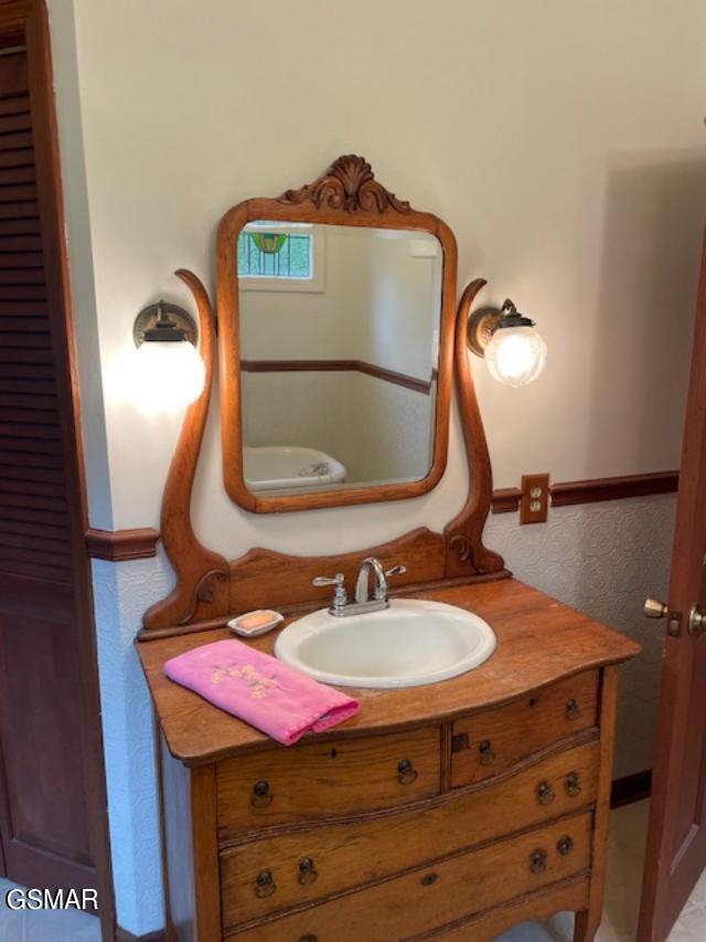 bathroom with vanity and toilet