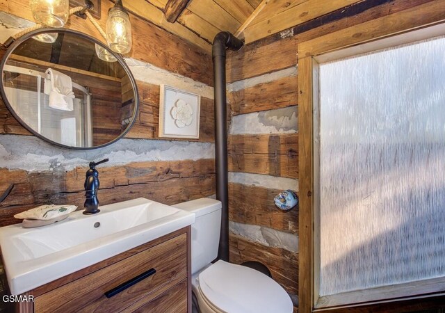 125 Cricket Hollow Way, Cosby, TN 37722 - bathroom featuring toilet, wood walls, lofted ceiling, vanity, and wooden ceiling