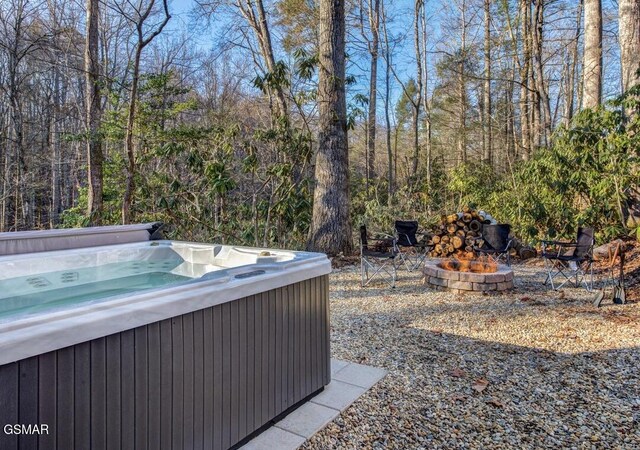 125 Cricket Hollow Way, Cosby, TN 37722 - view of yard featuring a hot tub, an outdoor fire pit, and a view of trees