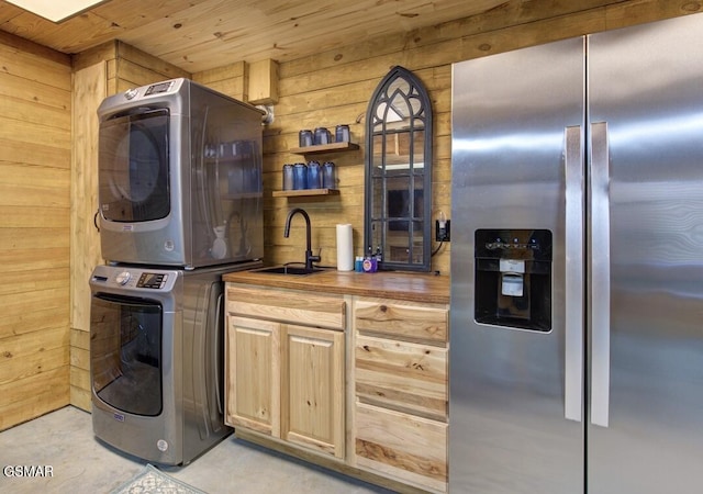 125 Cricket Hollow Way, Cosby, TN 37722 - kitchen with stainless steel refrigerator with ice dispenser, stacked washing machine and dryer, a sink, wooden counters, and wooden walls