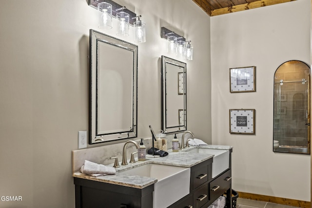 bathroom featuring tile patterned floors, vanity, wooden ceiling, and walk in shower