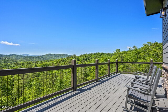 wooden terrace with a mountain view