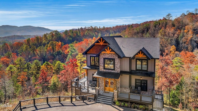 view of front of home with a mountain view and covered porch