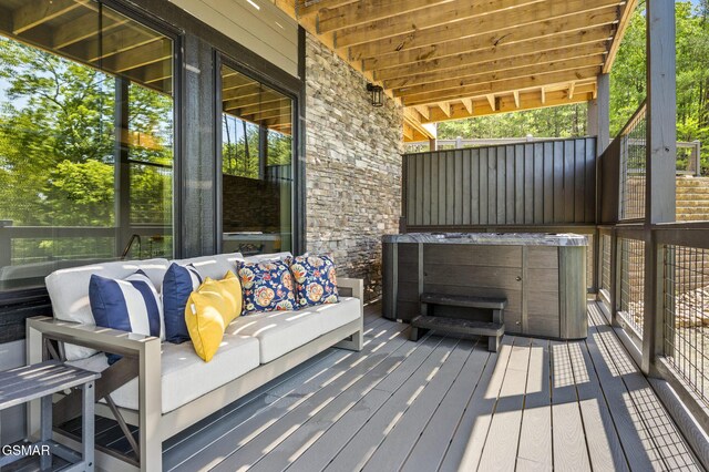 deck featuring a hot tub