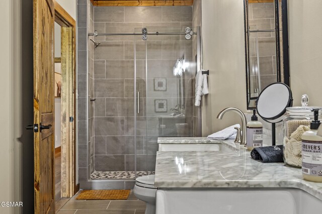 bathroom with vanity, toilet, and walk in shower