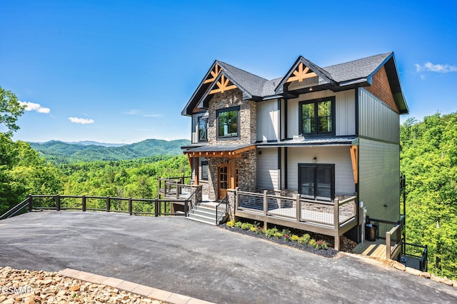 view of front of house with a mountain view and a porch