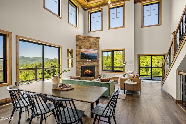 dining space with a wealth of natural light and a towering ceiling